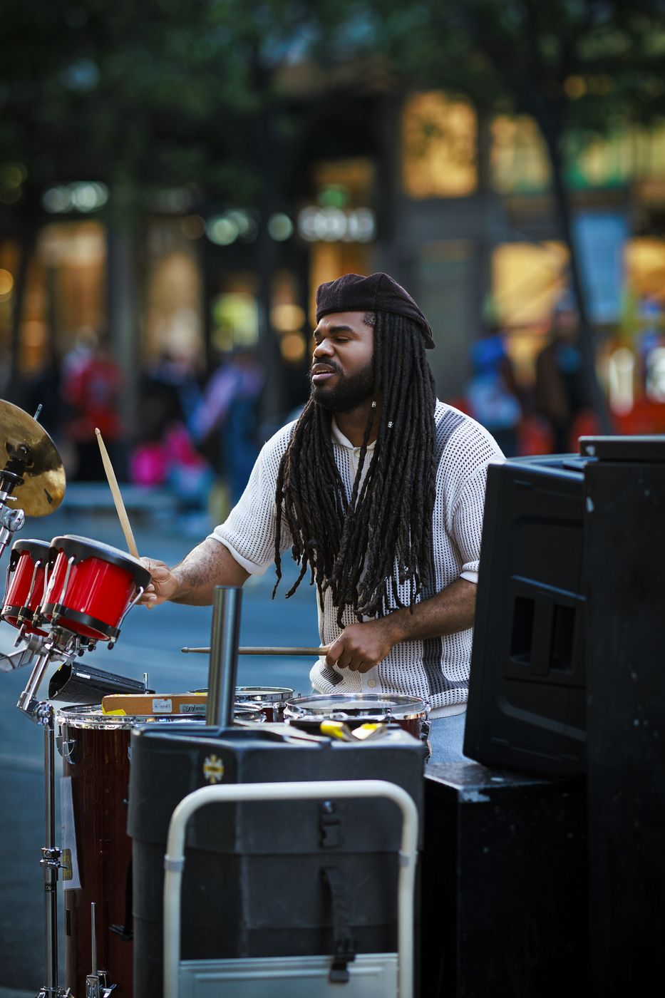 Street drummer performing in London — documentary street photography
